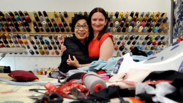 HELPING HAND: Thu Khanh Pham and Samantha Diplock are reunited at Mrs Pham's Woden alterations shop on Tuesday after Sunday's near tragedy, the cause of which is being investigated.