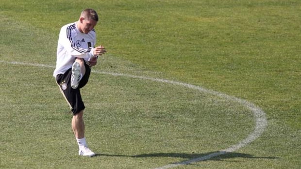 Bastian Schweinsteiger of Germany controls the ball during a training session at Super stadium on July 1, 2010.
