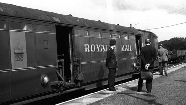 Investigators examine the Royal Mail train involved in the Great Train Robbery.
