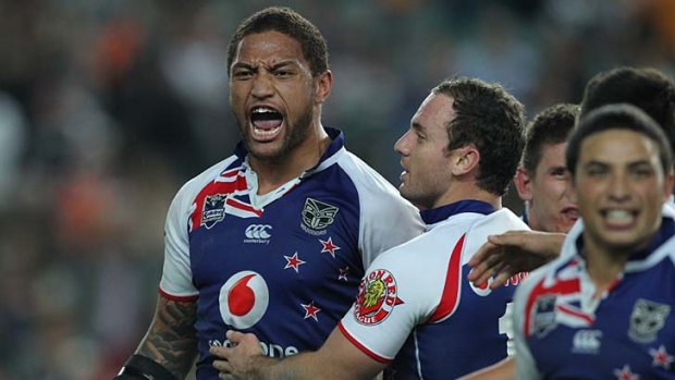 Playing havoc: New Zealand Warriors winger Manu Vatuvei (left) is a hard man to bring down.