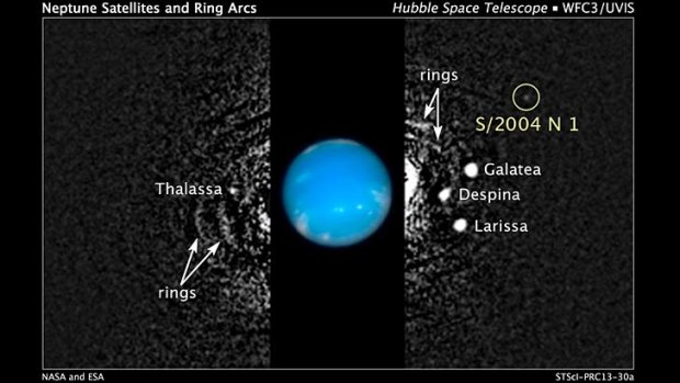 This composite Hubble Space Telescope picture shows the location of a newly discovered moon, designated S/2004 N 1, orbiting Neptune.