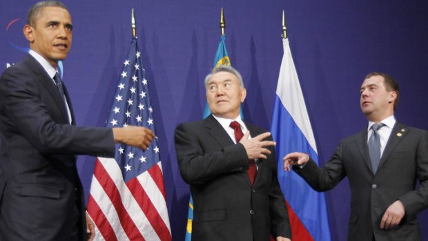 Barack Obama, left, stands with Kazakhstan President Nursultan Nazarbayev, center, and Russian President Dmitry Medvedev.