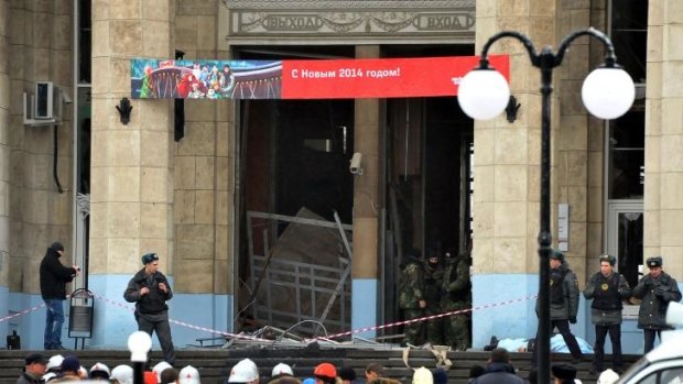 Russian security forces stand guard outside a train station following a suicide attack in Volgograd.