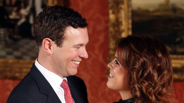 Britain's Princess Eugenie and Jack Brooksbank pose for the media at Buckingham Palace.