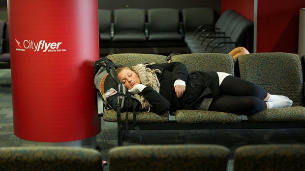 A traveller gets some sleep at Qantas's Melbourne terminal.