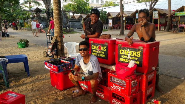 "Bali can sell beers, they can still relax by the beach and buy cool Bintang there." Kuta beach vendor Kadek Nova assures his customers. He's pictured with Gede Bayu (black T-shirt) and Kadek Lucky. 