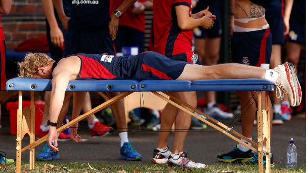 Flat out: Jack Watts on the rub-down table before training last week.