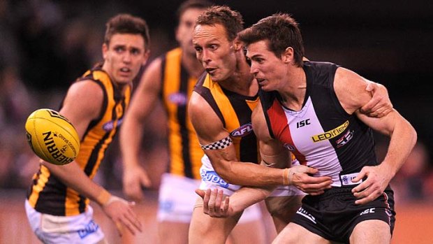 St Kilda's Lenny Hayes (right) and Hawthorn's Brad Sewell contest the ball at Etihad Stadium on Friday.