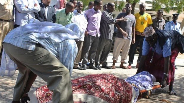 Somali MP's and relatives prepare to bury the body of slain Somali lawmaker Ahmed Mohamud Hayd, who was assassinated last month by al-Qaeda-linked Shebab. 