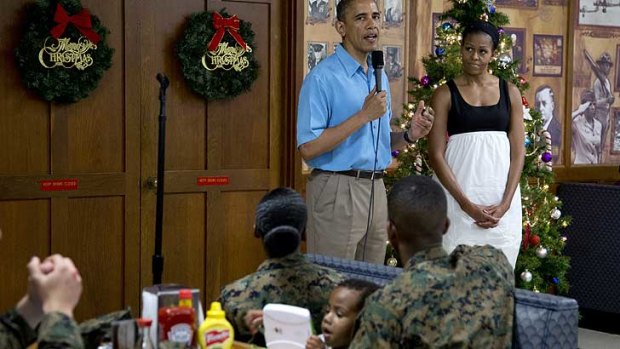 President Barack Obama ... with first lady Michelle Obama during a visit with members of the military and their families in Anderson Hall at Marine Corp Base, Hawaii.
