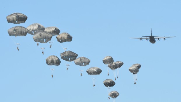 Airborne forces from the US, Great Britain and Poland conduct a a multi-national jump on to a designated drop zone near Torun, Poland.