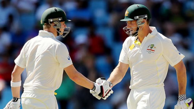 On song: Steve Smith and teammate Shaun Marsh during the first Test.