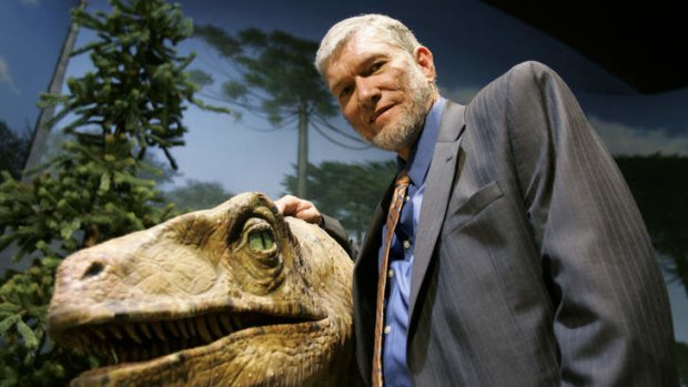 Walking with dinosaurs: Ken Ham, founder of Answers in Genesis, poses with one of his favourite animatronic dinosaurs at the Creation Museum in Petersburg, Kentucky.