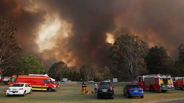 Wall of flames: Fire blackens the sky at Raymond Terrace.