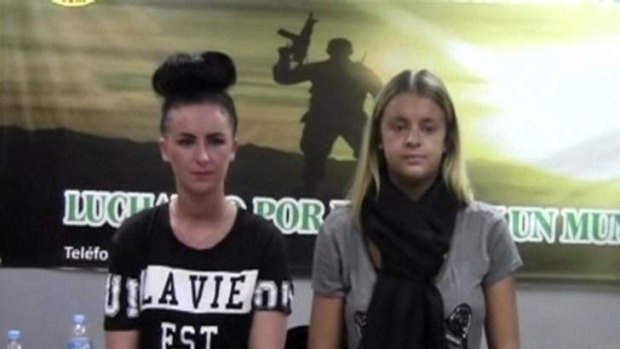 Irish woman, Michaella McCollum Connolly, 20, and British woman Melissa Reid, 19, stand as they are being questioned by police in Lima.