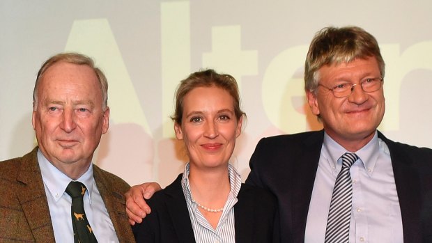 AfD top candidates Alexander Gauland, left, Alice Weidel and co-chairman Joerg Meuthen, right, celebrate with their supporters during the election party of the nationalist 'Alternative for Germany', AfD, in Berlin.