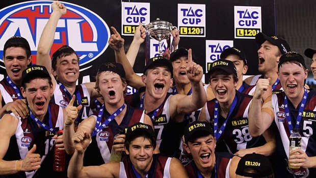 The Sandringham Dragons with their trophy after the TAC Cup grand final.