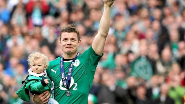 Brian O'Driscoll celebrates with his daughter Sadie as he sets a new world-record for Test appearances, taking his tally to 140, surpassing the mark he shared with former Australia scrum-half George Gregan.