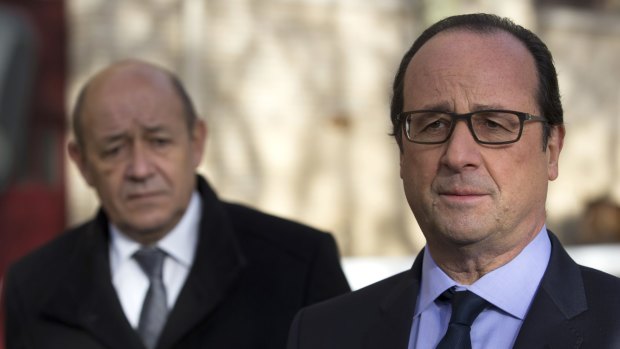 'France has no more hostages, in any part of the world ... French President Francois Hollande, right, flanked by Defence Minister Jean-Yves Le Drian.