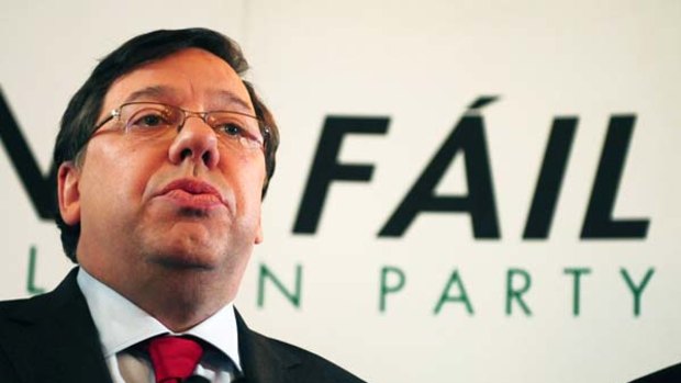 Surrender ... Brian Cowen quits as party leader.