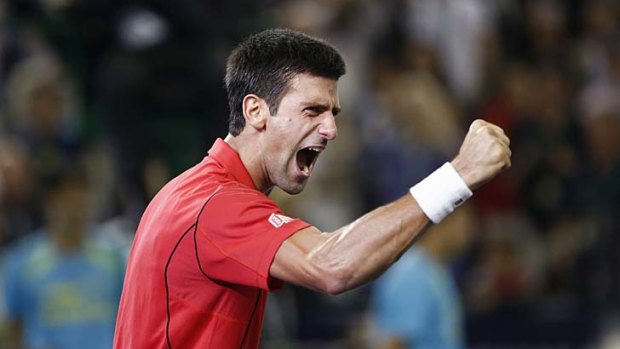 Novak Djokovic celebrates after winning the Shanghai Masters.