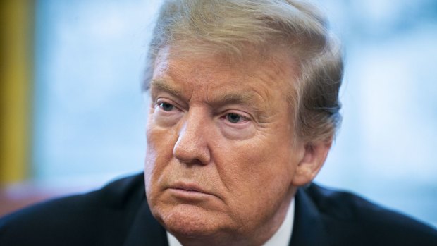 US President Donald Trump listens during a trade meeting with Liu He, China's Vice Premier.