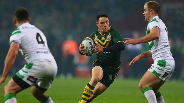 Cooper Cronk looks to evade the Irish defence during the clash at Limerick.