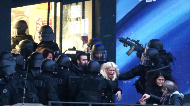 Police storm the building as hostages are freed. 
