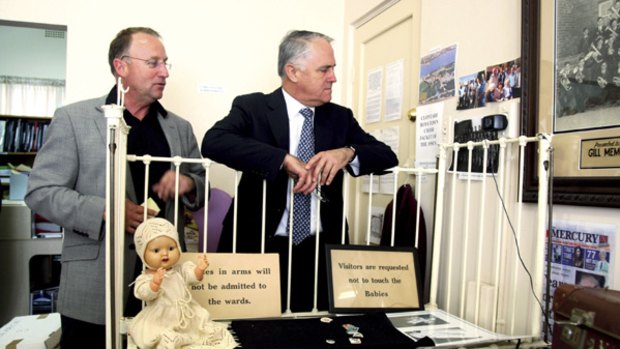 "Don't touch the babies"...Steve Irons and Malcolm Turnbull look at items from the history of institutions