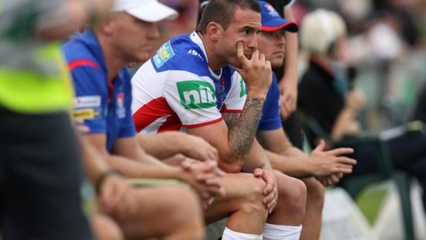 Newcastle Knights fullback Darius Boyd watches on from the bench during the round-one clash with Penrith.