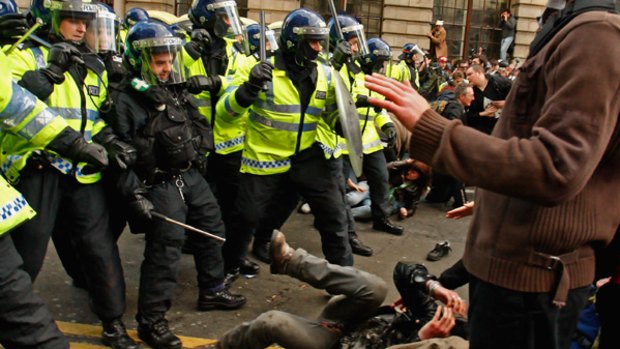 Protesters clash with police outside the Bank of England.