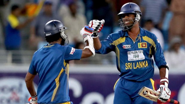 Dimuth Karunaratne and Sachithra Senanayaka of Sri Lanka celebrate after winning the second one-day International against Pakistan on Friday.