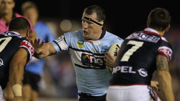 Paul Gallen takes the ball up against the Sydney Roosters on Monday night.