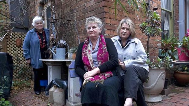 Former nun and double abuse victim Catherine Arthur (standing) with Helen Last (centre), an advocate representing victims of abuse, and abuse victim Noreen Wood, in Melbourne yesterday. <i>Photo: Luis Enrique Ascui</i>