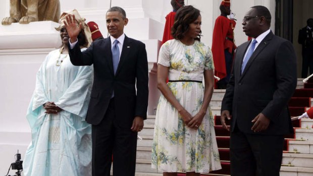 Welcomed: US President Barack Obama and his wife Michelle with the Senegalese President Macky Sall, right, and his Mariame Faye  at the presidential palace in Dakar.