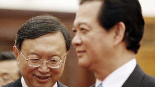 Chinese State Councillor Yang Jiechi (left) smiles during a meeting with Vietnamese Prime Minister Nguyen Tan Dung (right) in Hanoi during a meeting over China's stationing of an oil rig in disputed waters. 
