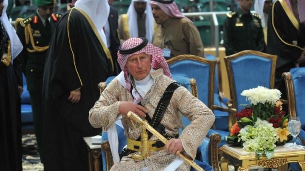 Sharp dresser: Britain's Prince Charles, wearing a Saudi uniform, attends a traditional Saudi dance at Der'iya in Riyadh.
