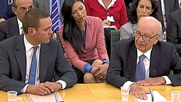 James Murdoch and Rupert Murdoch appear before a parliamentary committee on phone hacking at Portcullis House in London July 19, 2011.