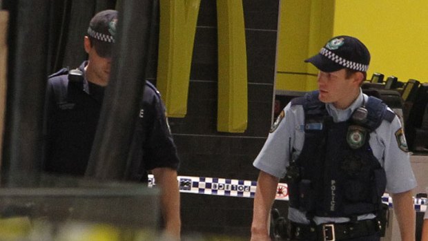 Police patrol the Westfield shopping centre after the shooting.