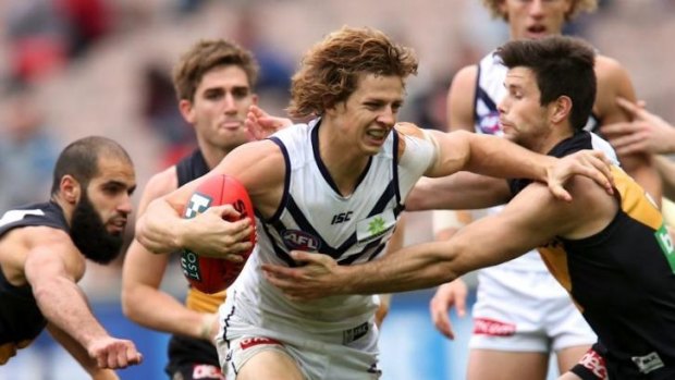 Nathan Fyfe tries to break out of the congestion.