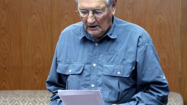 This file photo taken on November 9, 2013, and released on Novermber 30, 2013, by North Korea's official Korean Central News Agency (KCNA) shows US citizen Merrill Newman reading a written apology for his alleged crimes both as a tourist and during his participation in the Korean War, while under detention in Pyongyang.  The United States welcomed North Korea's release of the American Korean War veteran.