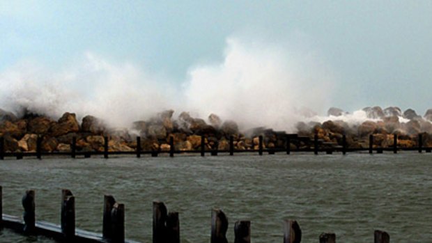 A reader photo shows waves crashing over the marina wall at Ocean Reef.