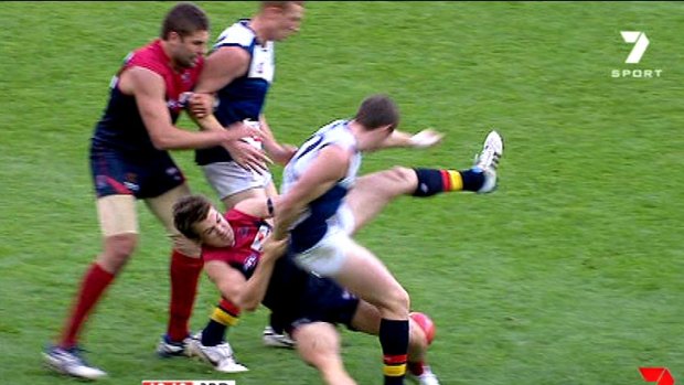 Suspended: Melbourne's Jack Trengove hauls Adelaide's Patrick Dangerfield to the ground.