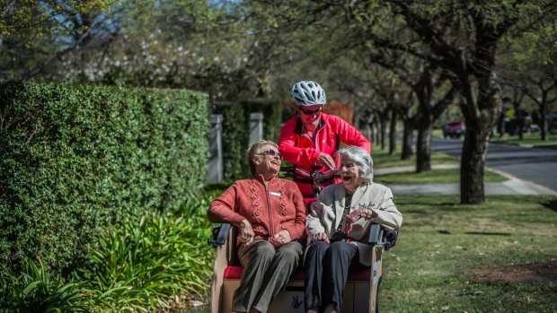 Adrienne Capp, 80 and Beryl Hunter, 99, piloted by Caroline Fargher of Pedal power. 