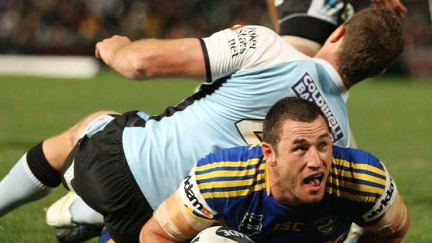 Ben Smith crosses in the Eels' 34 point demolition of the Sharks at Parramatta Stadium.