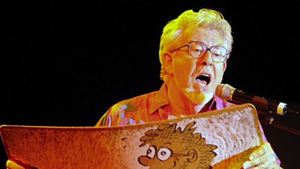 No.1? Rolf Harris performs with his wobble board at the Sydney Opera House.