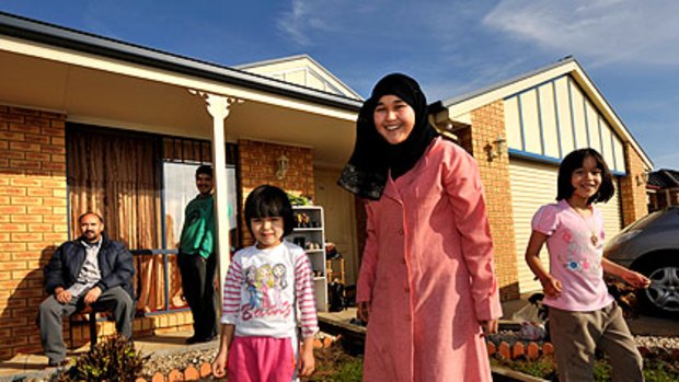 The Lashkaris - Ahmad (seated), Mohommad, Amina, Rukari and Zahra - are among about 700 Afghans who call Shepparton home.