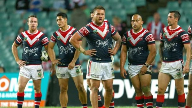 Difficult challenge: Dejected Roosters players watch Jamie Soward convert a try on Saturday night.