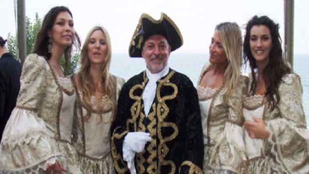 European vacation ... the head of Storm Financial, Emmanuel Cassimatis, with entertainers on a trip in 2007.