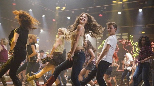 Step, one-two: Ren (Kenny Wormald) and Ariel (Julianne Hough) help make line dancing palatable in the entertaining dance flick <i>Footloose</i>.